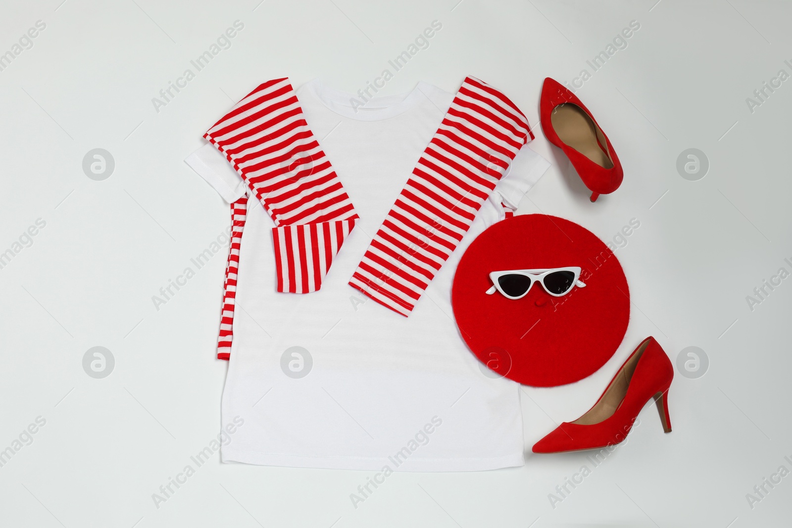 Photo of Retro styled outfit on white background, flat lay