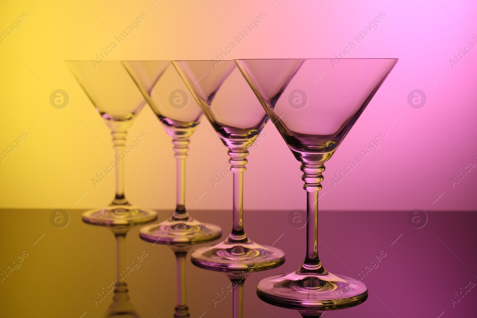 Photo of Empty glasses on table, color tone effect