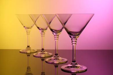 Photo of Empty glasses on table, color tone effect