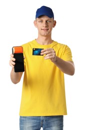 Photo of Happy courier with payment terminal and debit card on white background