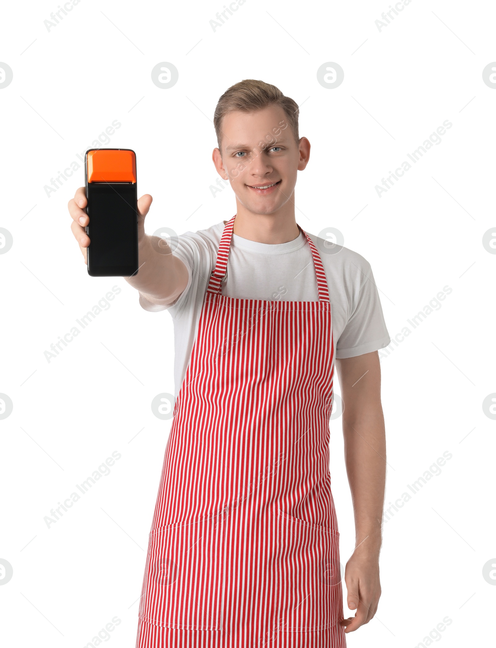 Photo of Happy young man in apron with payment terminal on white background