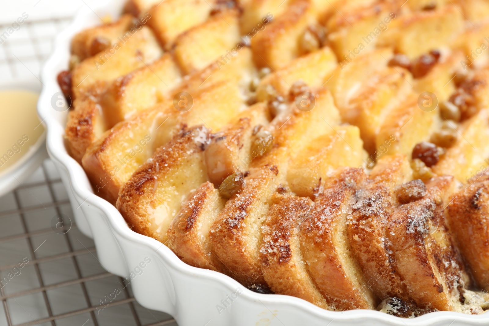 Photo of Delicious bread pudding with raisins on table, closeup