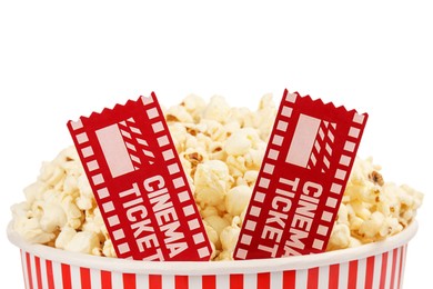 Photo of Tasty popcorn and movie tickets isolated on white