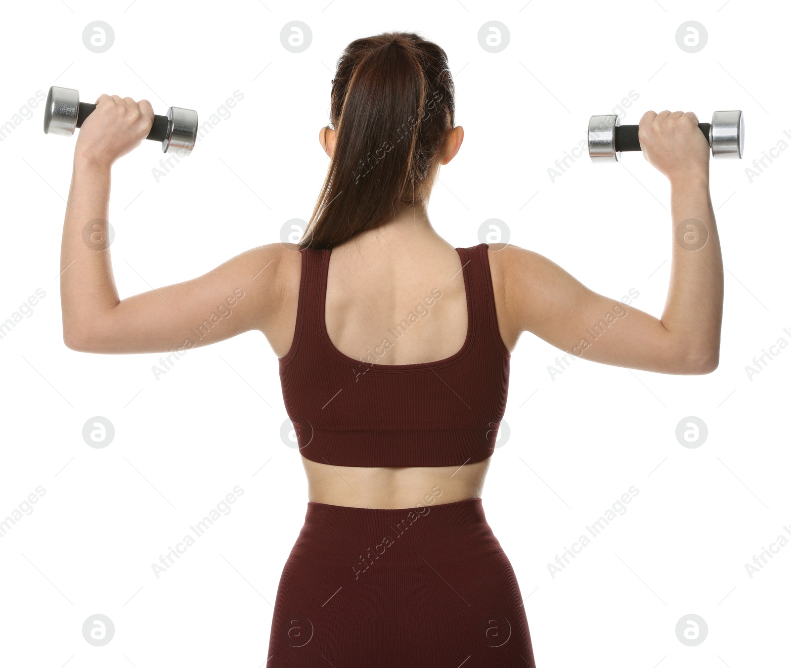 Photo of Woman in sportswear exercising with dumbbells on white background, back view