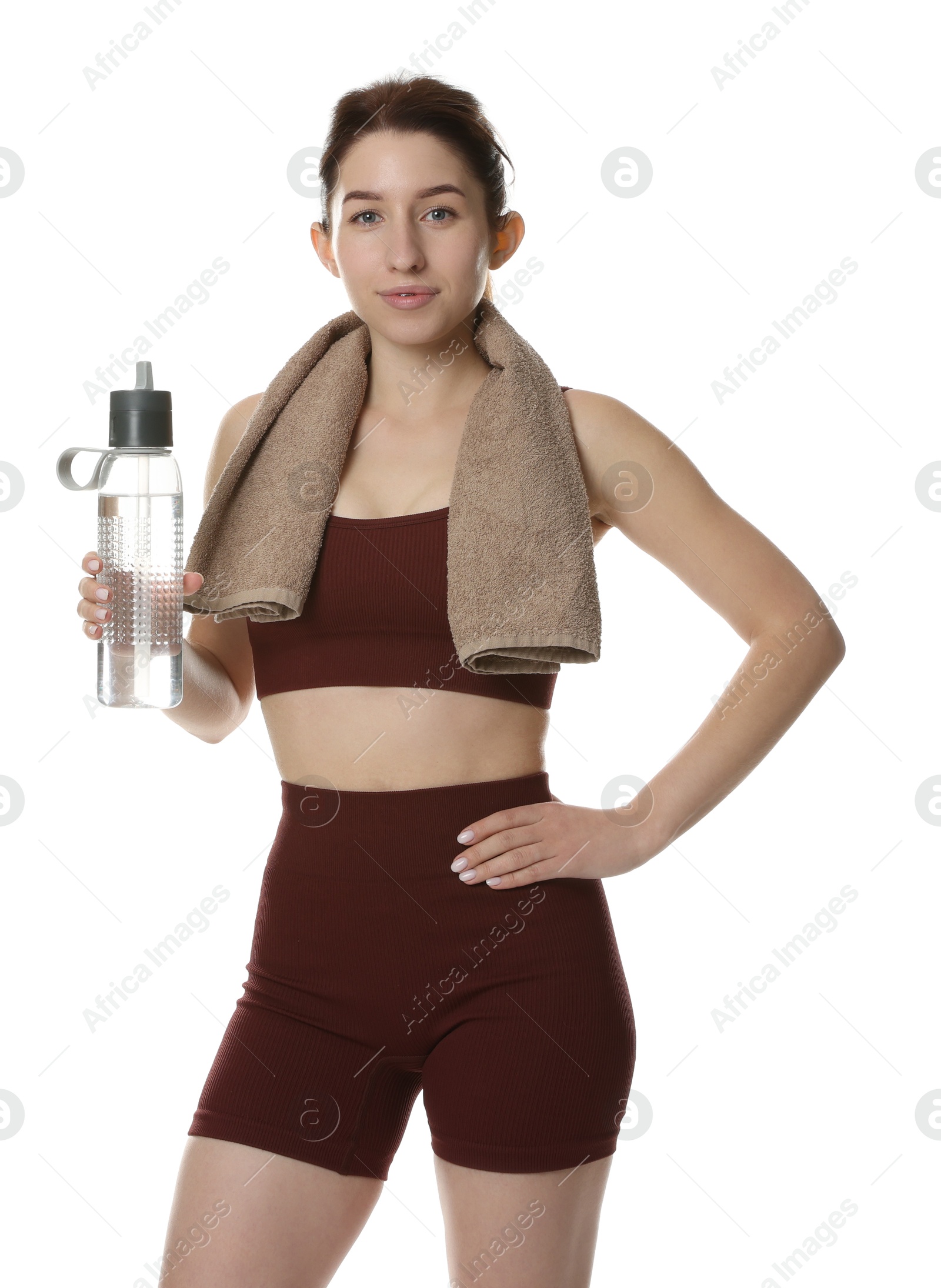 Photo of Woman in sportswear with bottle of water on white background