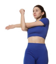 Photo of Woman in sportswear exercising on white background