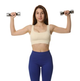 Woman in sportswear exercising with dumbbells on white background