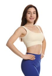 Portrait of woman in sportswear on white background