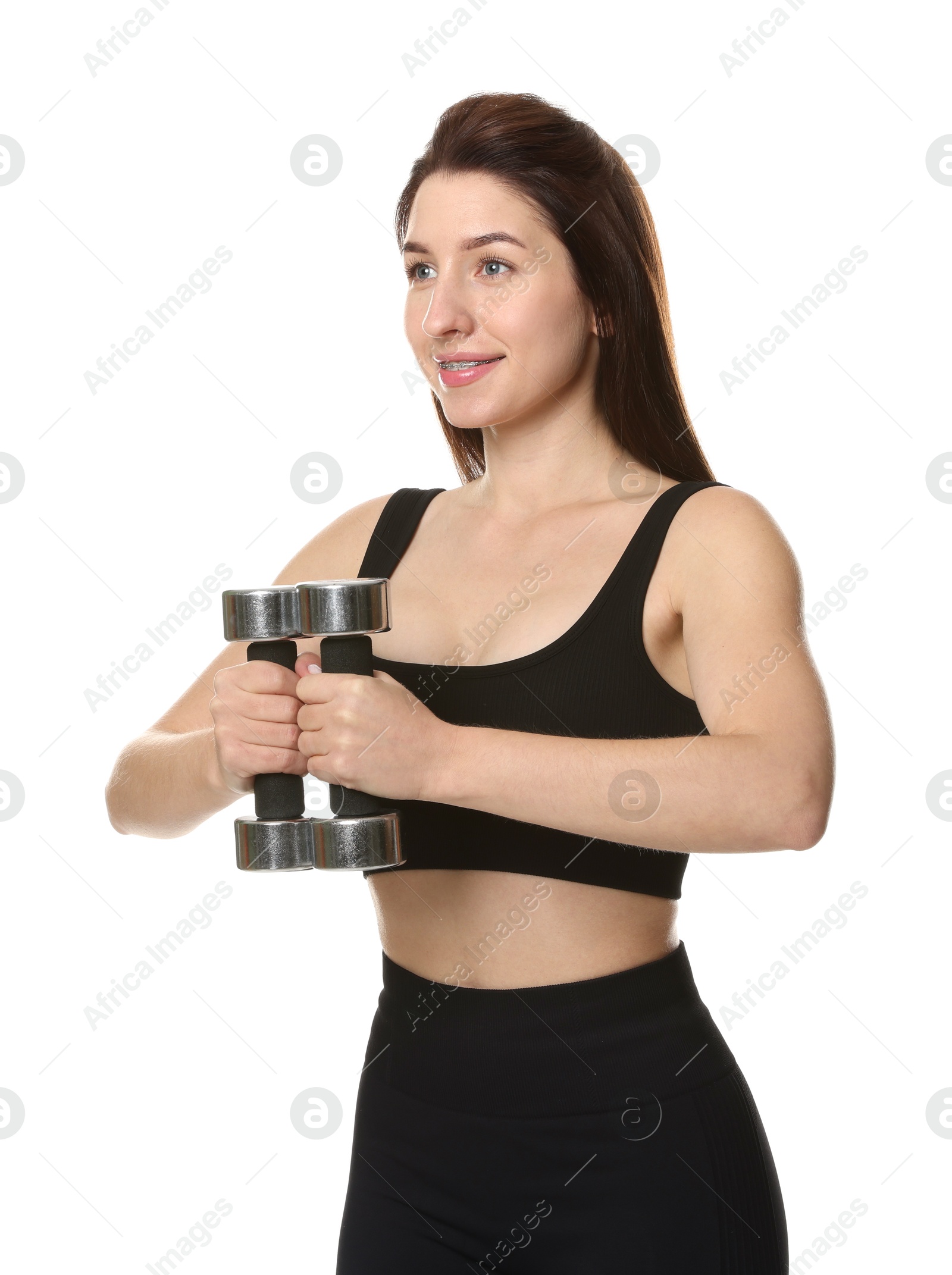 Photo of Woman in sportswear exercising with dumbbells on white background