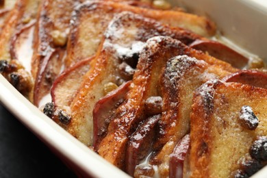 Photo of Freshly baked bread pudding in baking dish, closeup