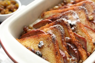 Photo of Freshly baked bread pudding in baking dish, closeup