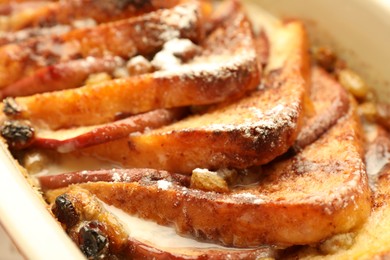 Photo of Freshly baked bread pudding in baking dish, closeup