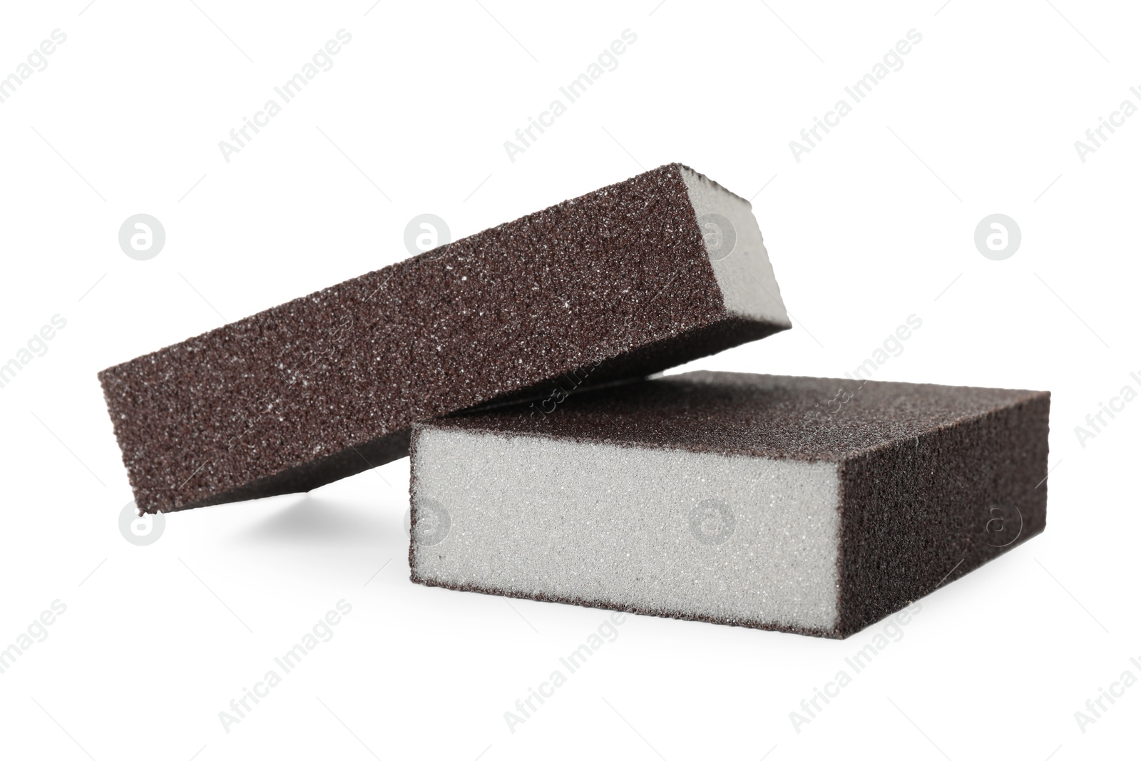 Photo of Two brown sponges isolated on white. Cleaning supply