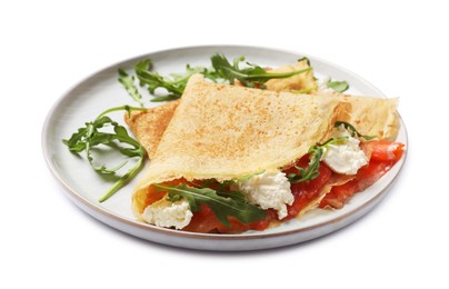 Photo of Delicious crepes with salmon, cream cheese and arugula isolated on white