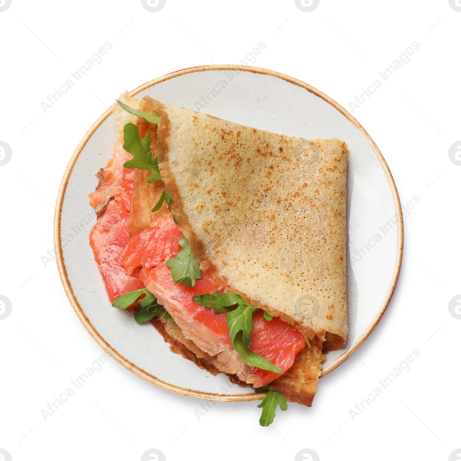 Photo of Delicious crepe with salmon and arugula isolated on white, top view