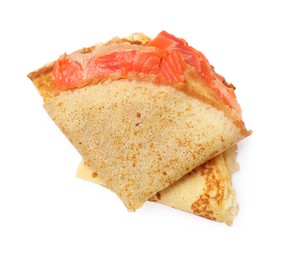 Photo of Delicious crepes with salmon isolated on white, top view