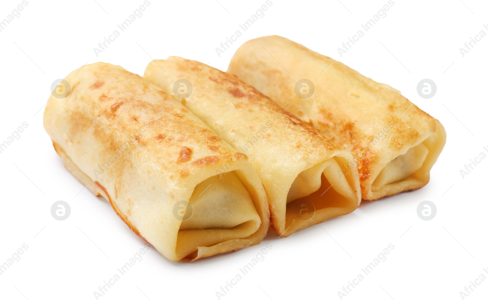 Photo of Three delicious rolled crepes isolated on white