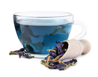 Photo of Butterfly pea flower tea in cup and scoop with buds isolated on white