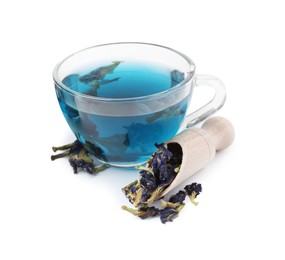 Photo of Butterfly pea flower tea in cup and scoop with buds isolated on white