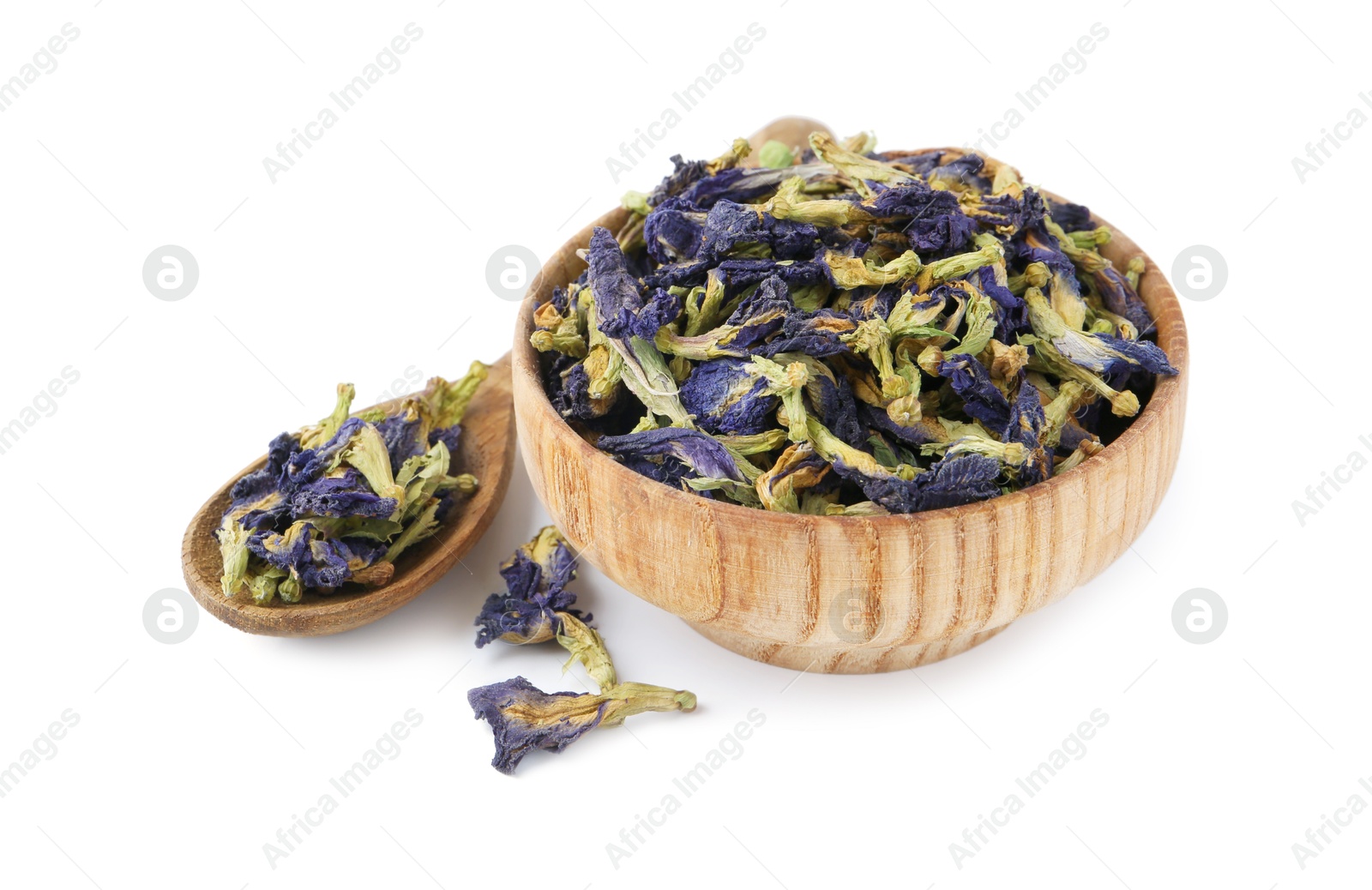 Butterfly pea flower tea in bowl and spoon isolated on white Photo of Butterfly pea flower tea in bowl and spoon isolated on white