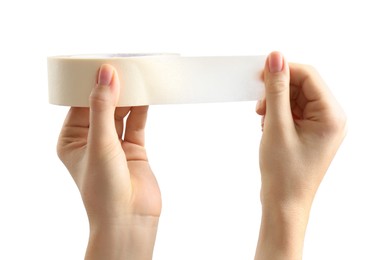 Photo of Woman with roll of masking tape on white background, closeup