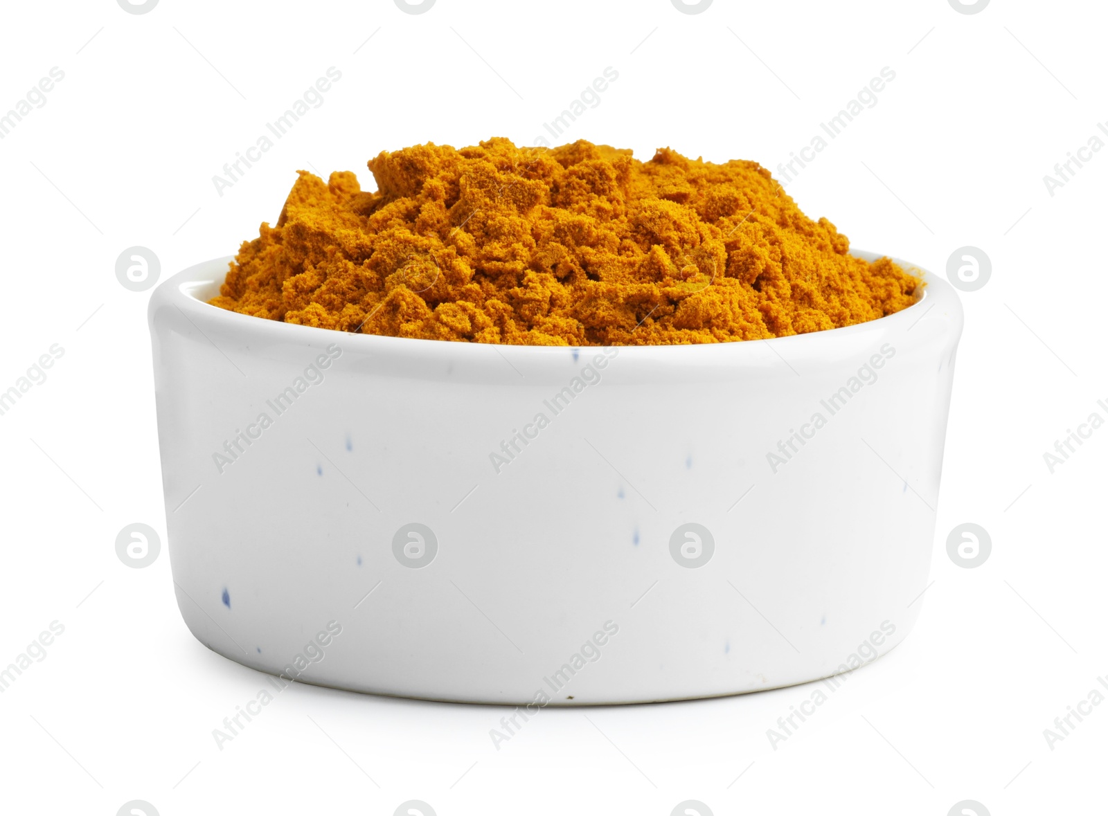 Photo of Turmeric powder in bowl isolated on white