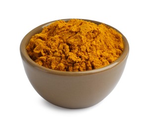 Photo of Turmeric powder in bowl isolated on white