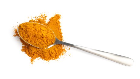 Photo of Turmeric powder and spoon isolated on white, top view