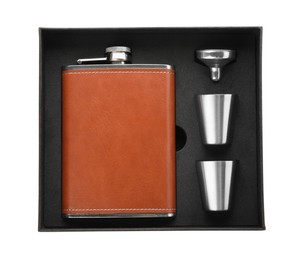 Photo of Hip flask, cups and funnel in package isolated on white, top view