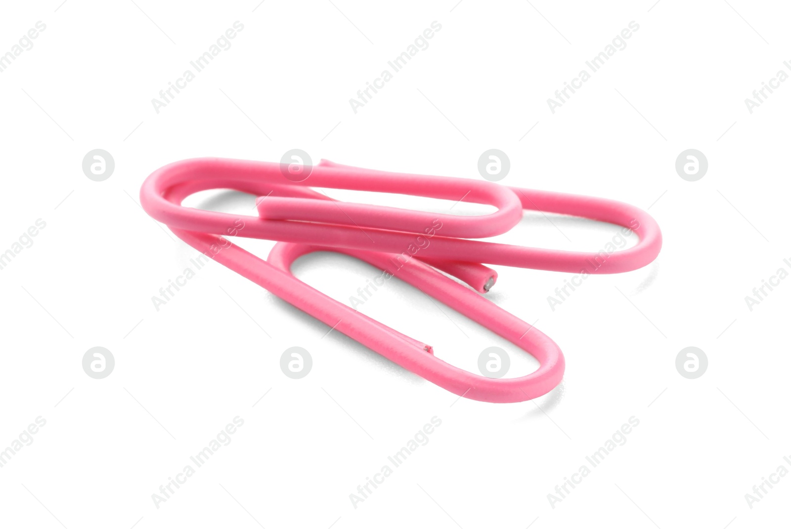 Photo of Two pink paper clips isolated on white