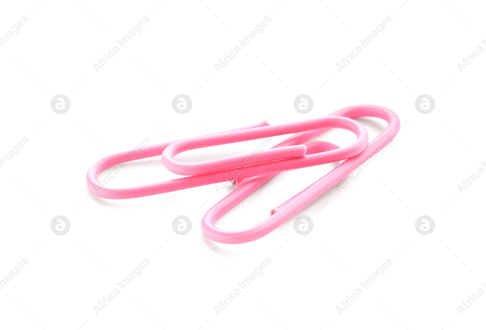 Photo of Two pink paper clips isolated on white