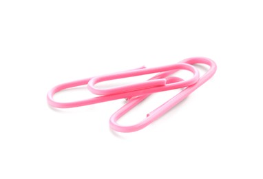 Photo of Two pink paper clips isolated on white