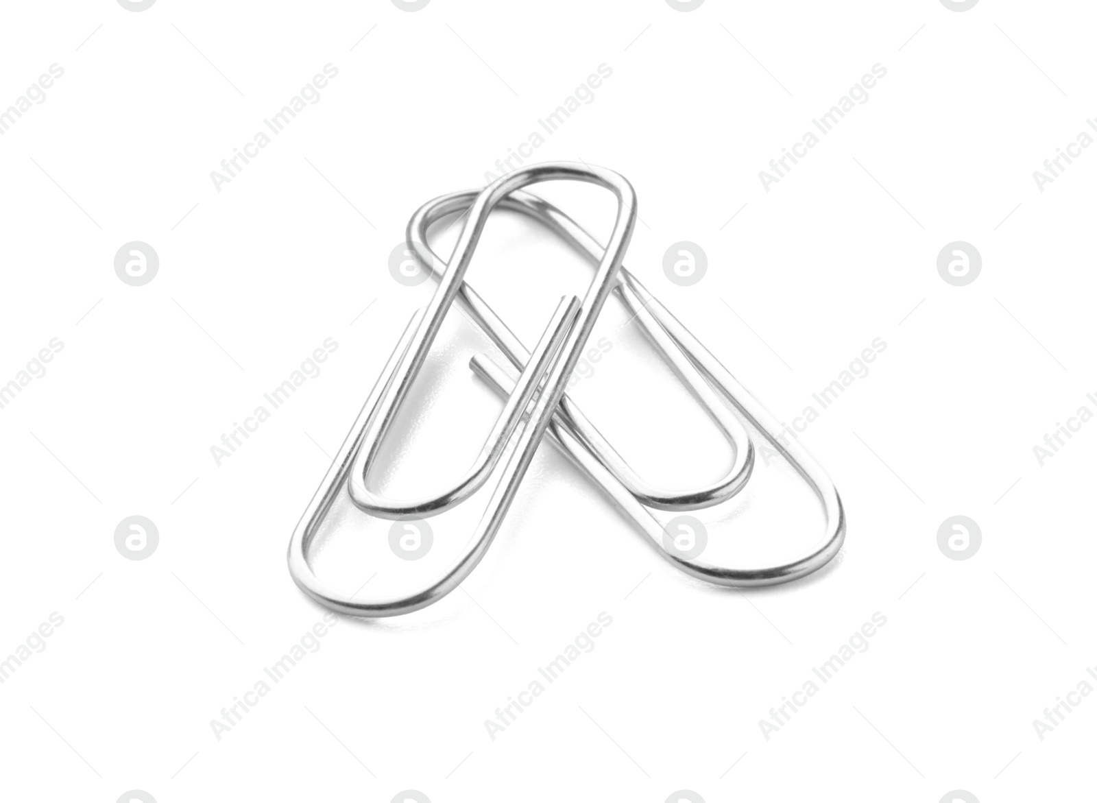 Photo of Two metal paper clips isolated on white