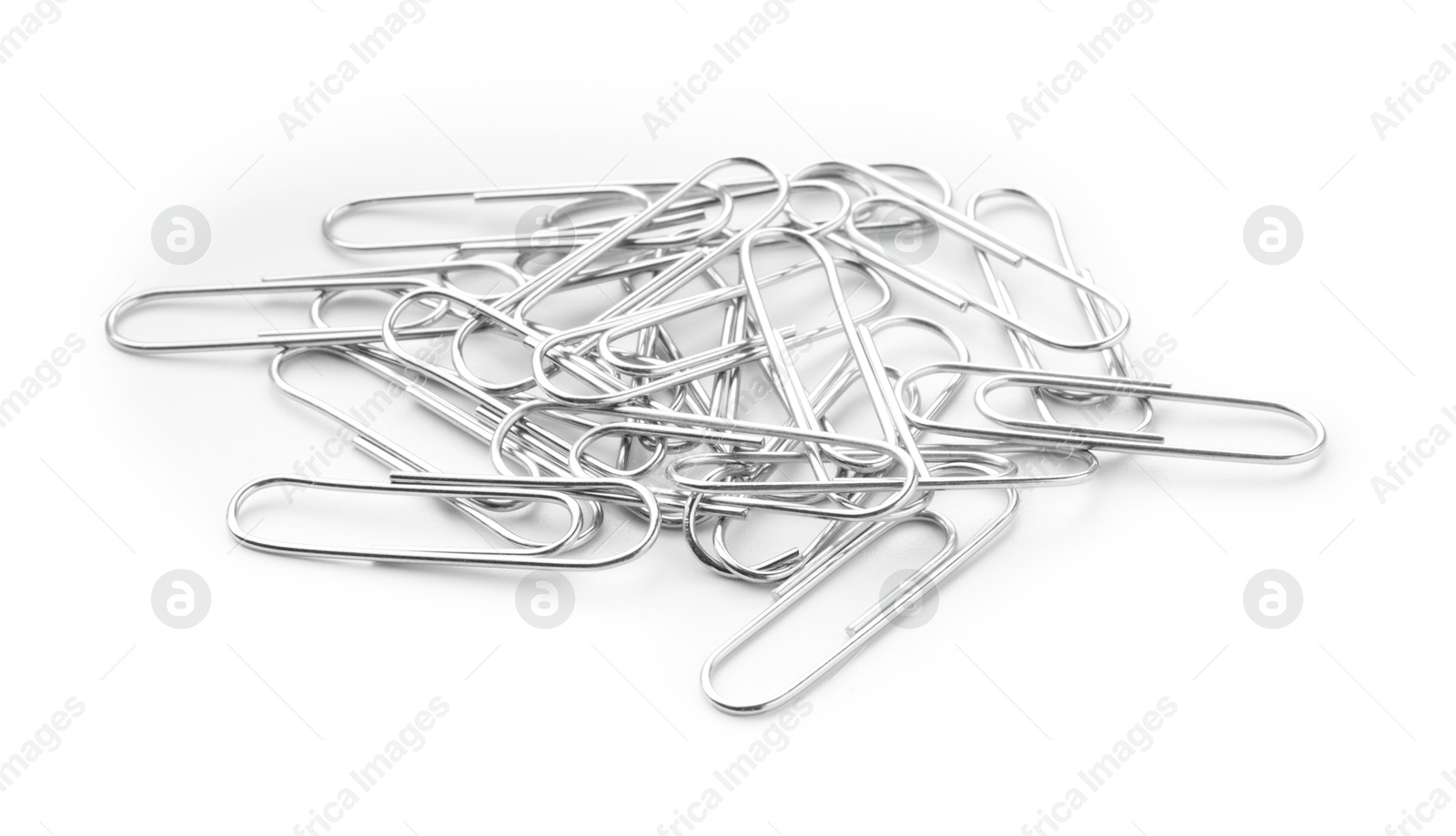 Photo of Pile of metal paper clips isolated on white, above view