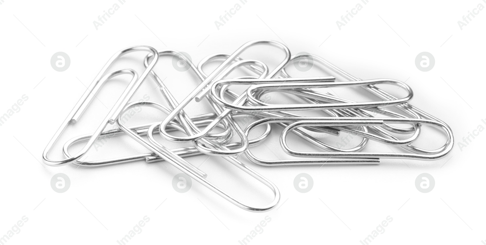 Photo of Many metal paper clips isolated on white