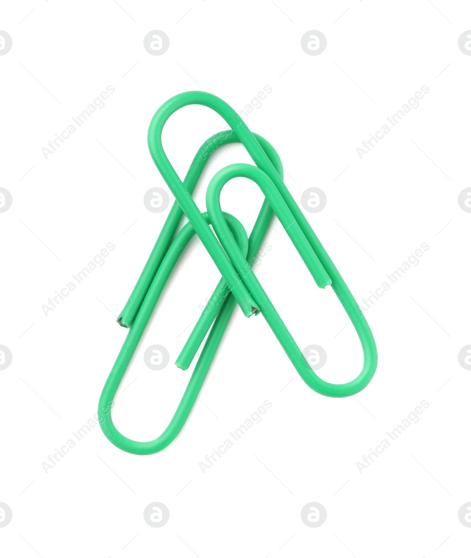 Photo of Green paper clips isolated on white, top view