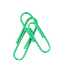 Photo of Green paper clips isolated on white, top view