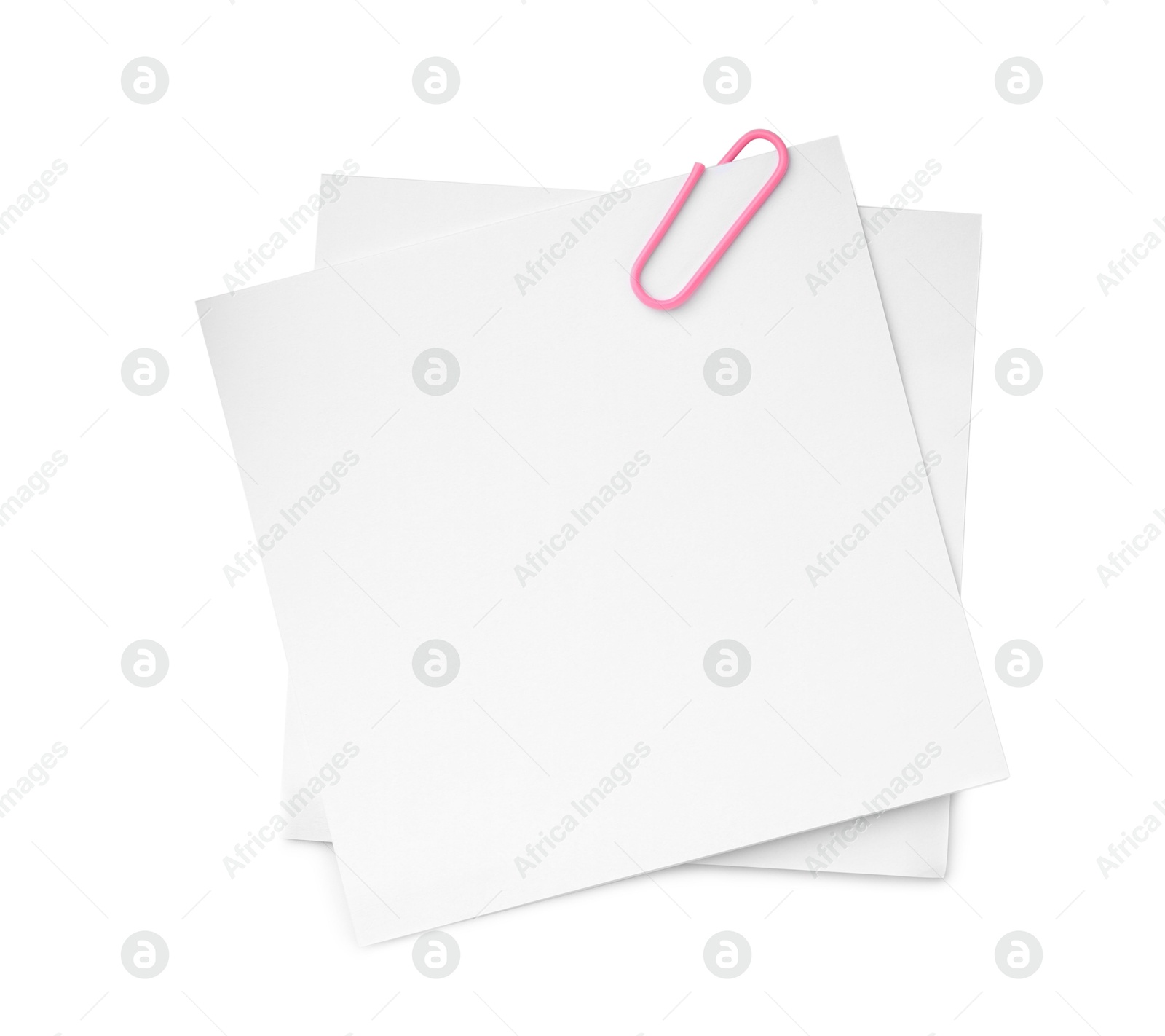 Photo of Blank paper notes attached with clip isolated on white, top view