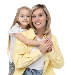 Happy mother and her cute little daughter on white background