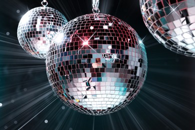 Image of Disco balls reflecting light on dark background. Nightclub decor