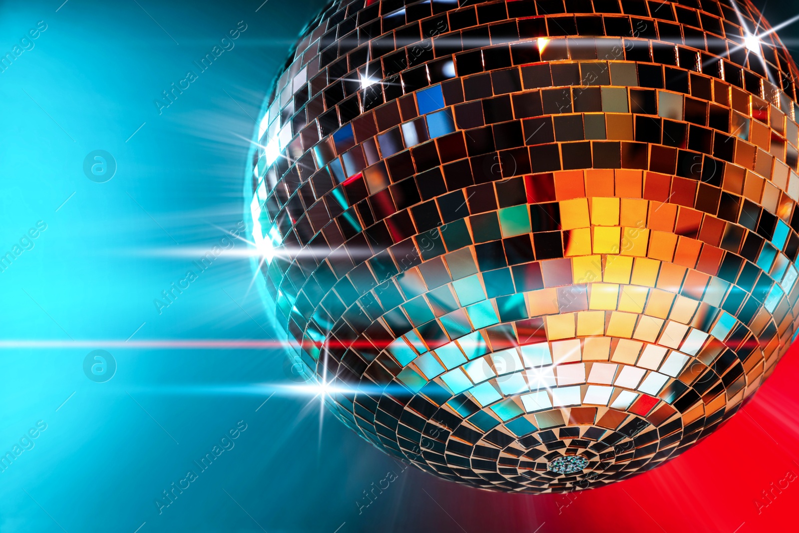 Image of Disco ball reflecting light on colorful background. Nightclub decor