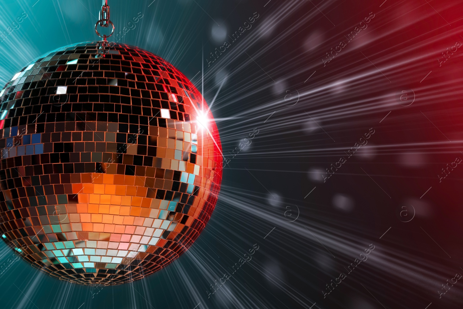 Image of Disco ball reflecting light on dark background. Nightclub decoration