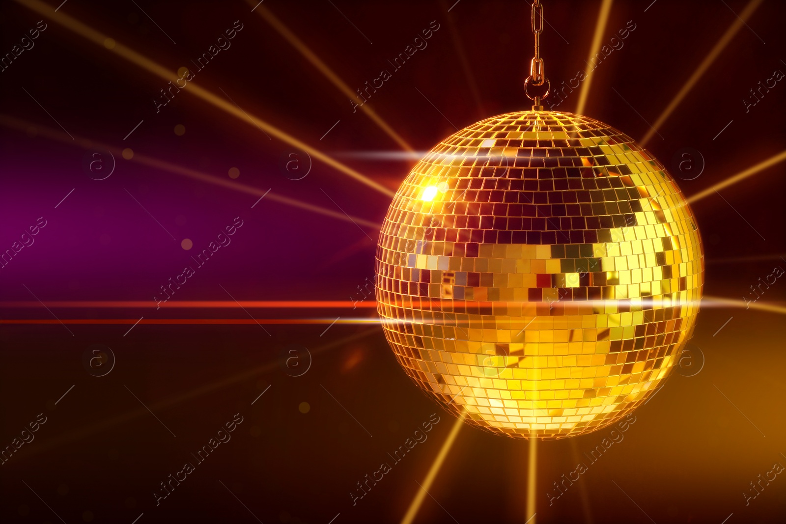 Image of Disco ball reflecting light on dark background. Nightclub decoration