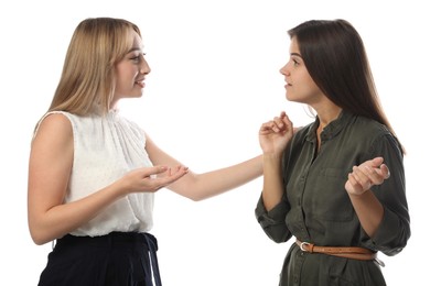 Photo of Young women in casual clothes talking on white background