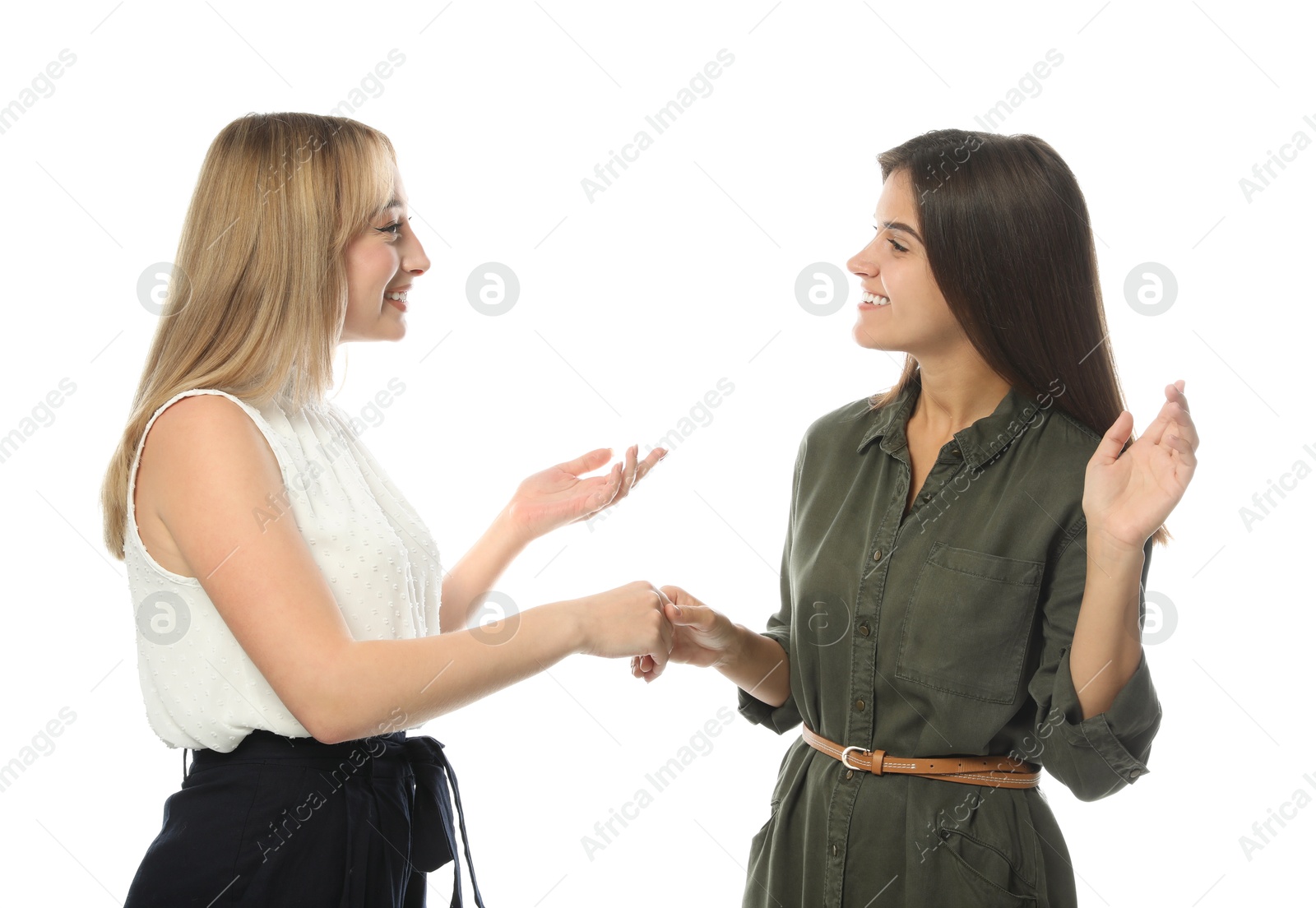 Photo of Young women in casual clothes talking on white background