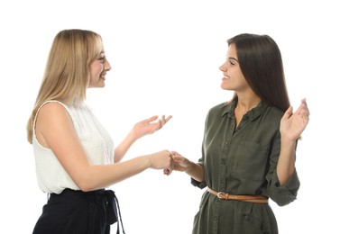 Young women in casual clothes talking on white background