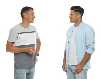 Photo of Men in casual clothes talking on white background