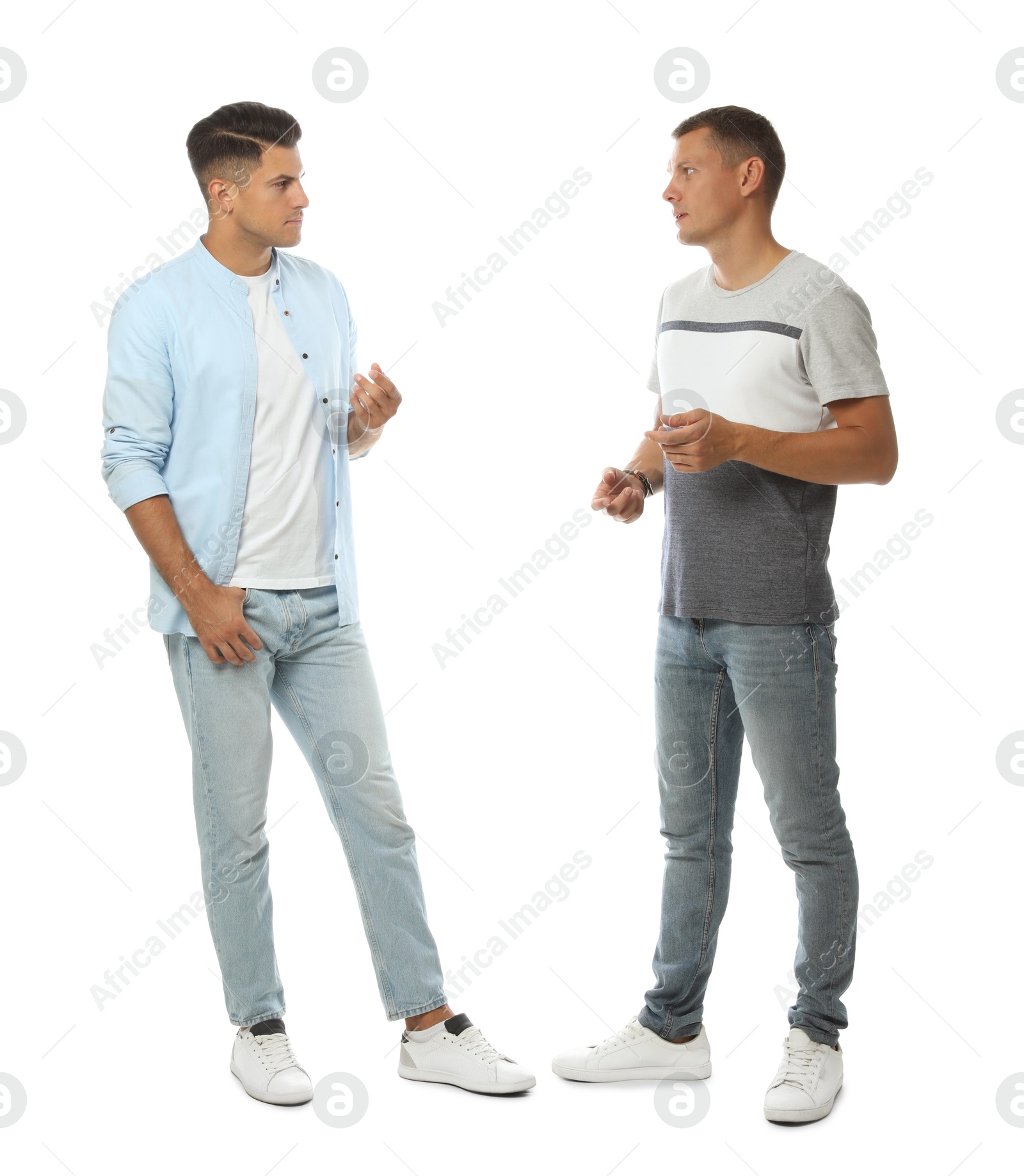 Photo of Men in casual clothes talking on white background