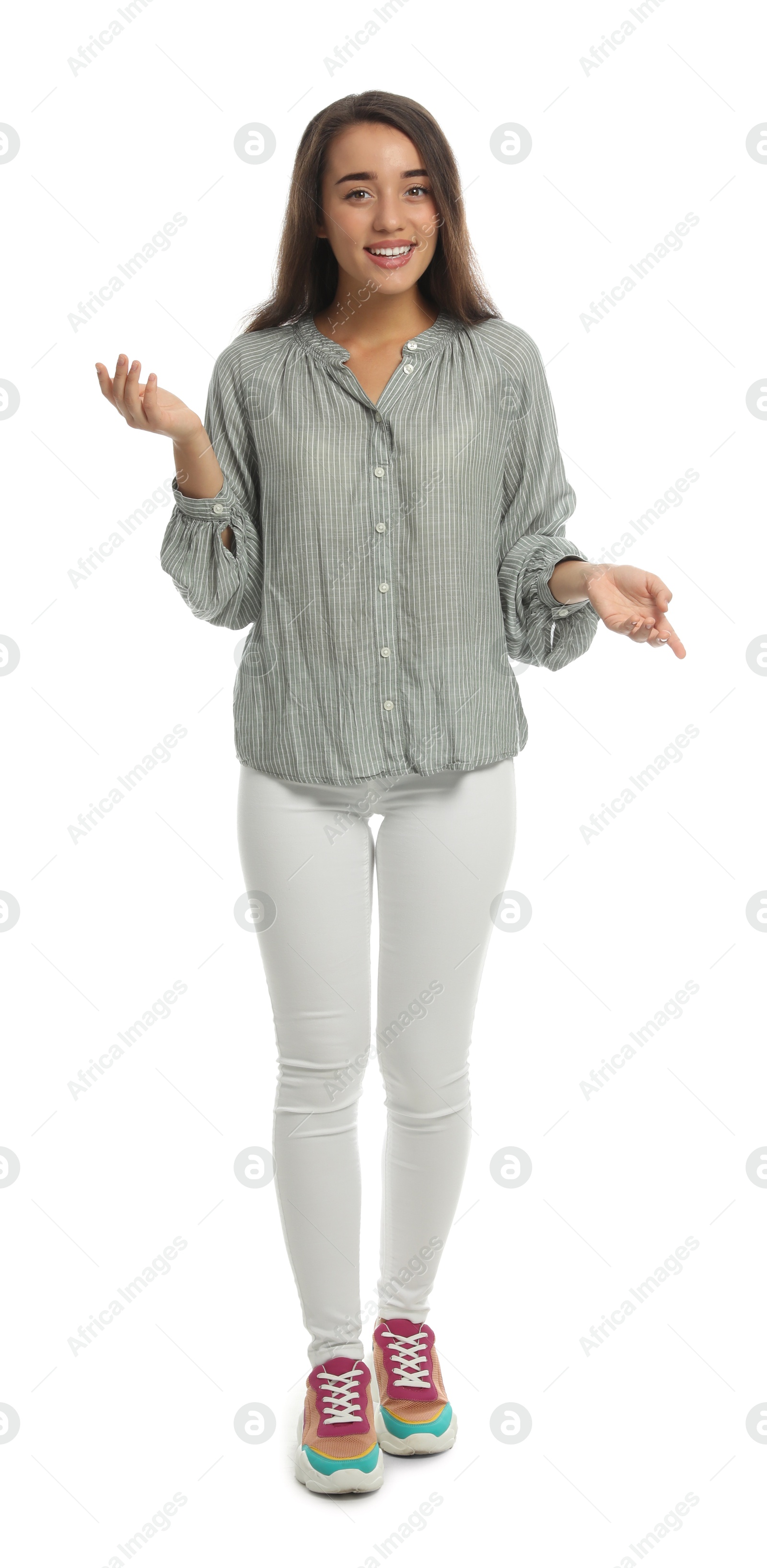 Photo of Young woman in casual clothes talking on white background