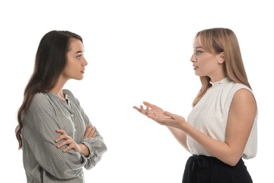 Young women in casual clothes talking on white background